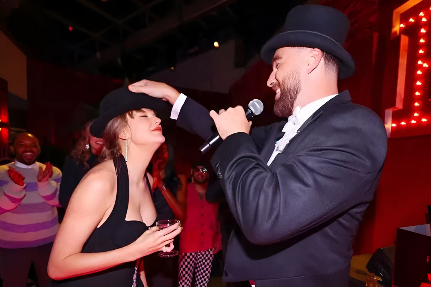 Travis Kelce Gives Taylor Swift the 'Last 22 Hat' at the 'Giant Surprise' Eras Tour Party He Threw
